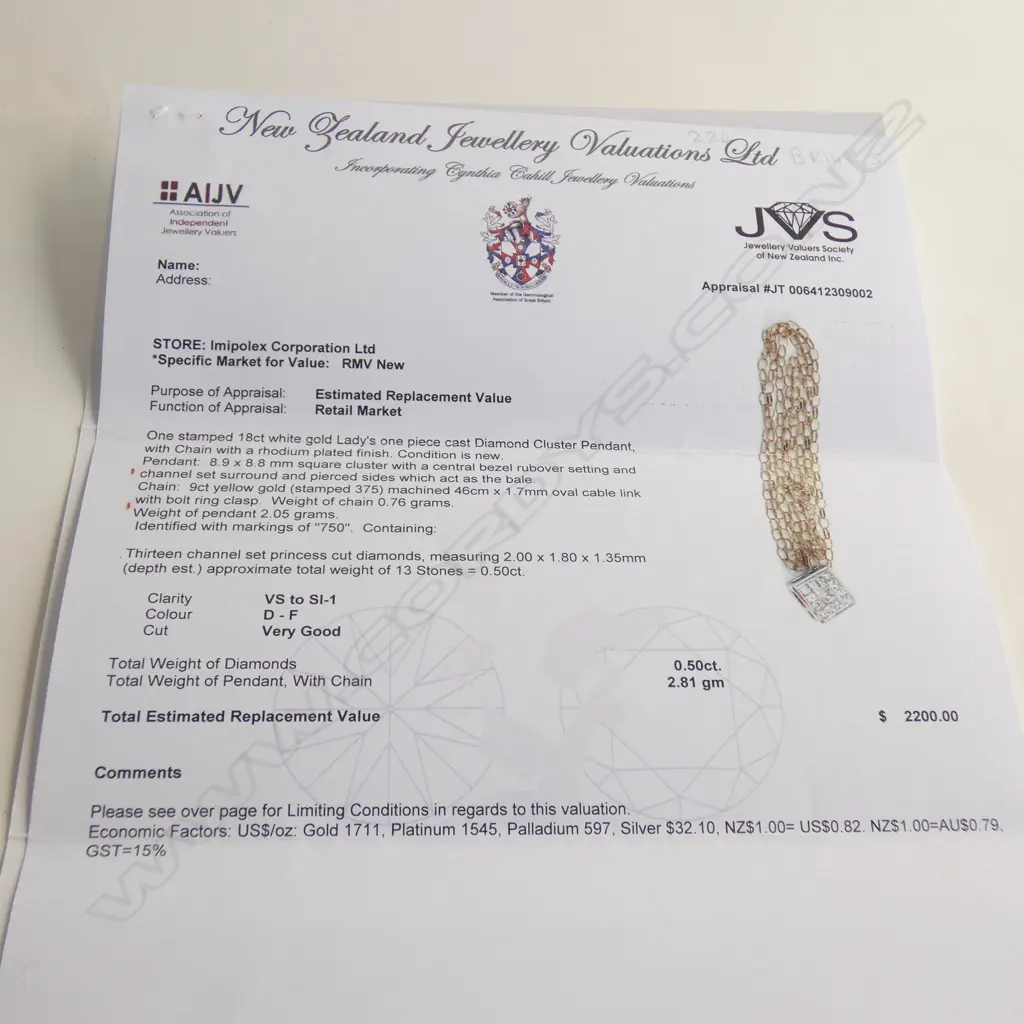 An 18ct white gold and diamond pendant Image 1++