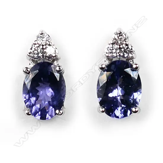 A pair of 14ct white gold, tanzanite and diamond stud earrings,