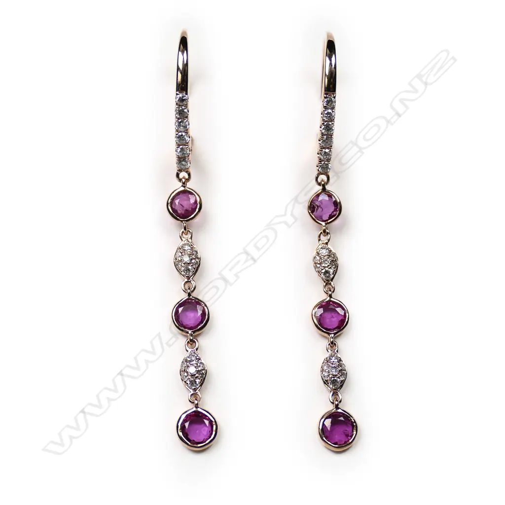 A pair of 14ct rose gold, ruby and diamond drop earrings Image 1++