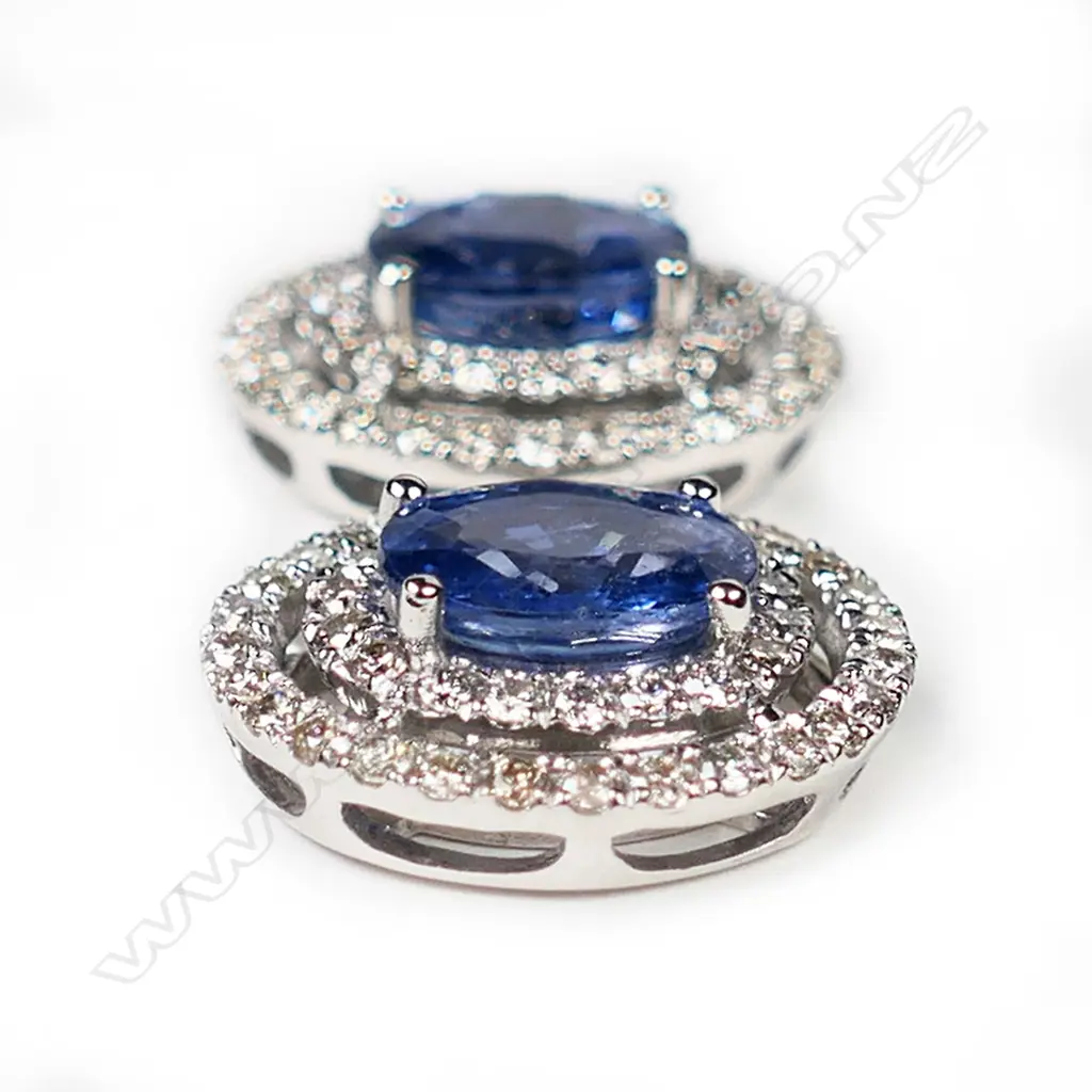 A pair of 14ct white gold, Ceylonese sapphires and diamond double halo earrings, Image 1++