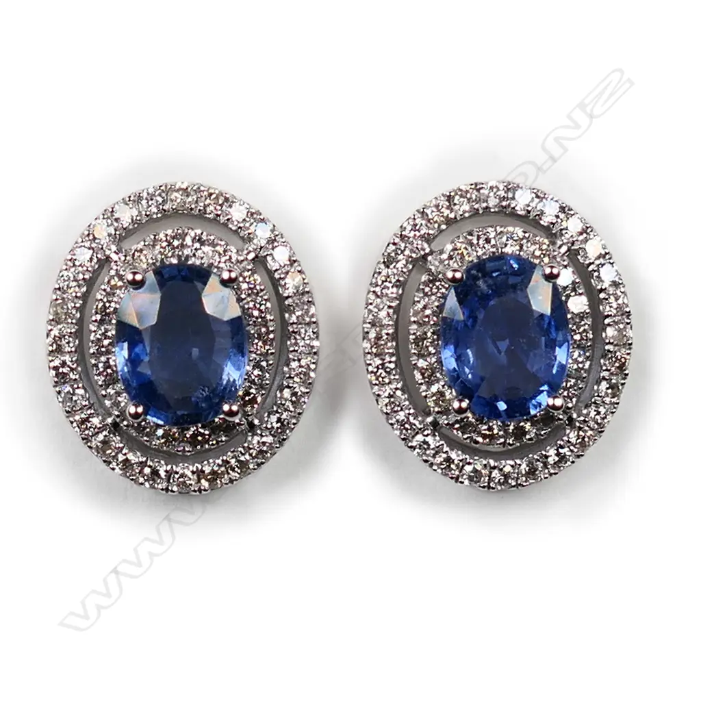 A pair of 14ct white gold, Ceylonese sapphires and diamond double halo earrings, Image 1++