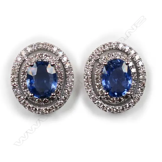 A pair of 14ct white gold, Ceylonese sapphires and diamond double halo earrings,