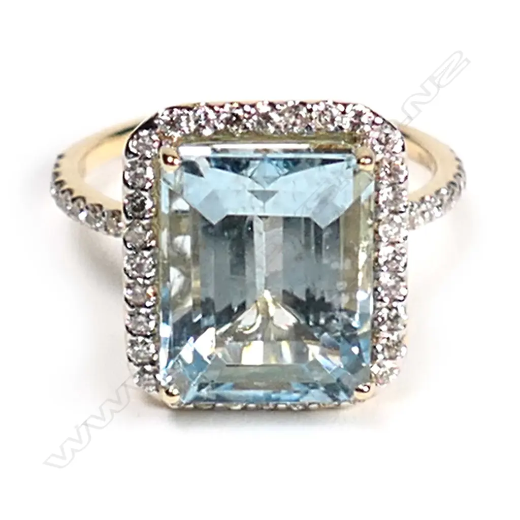 A 14ct. gold, aquamarine and diamond halo ring, Image 1++