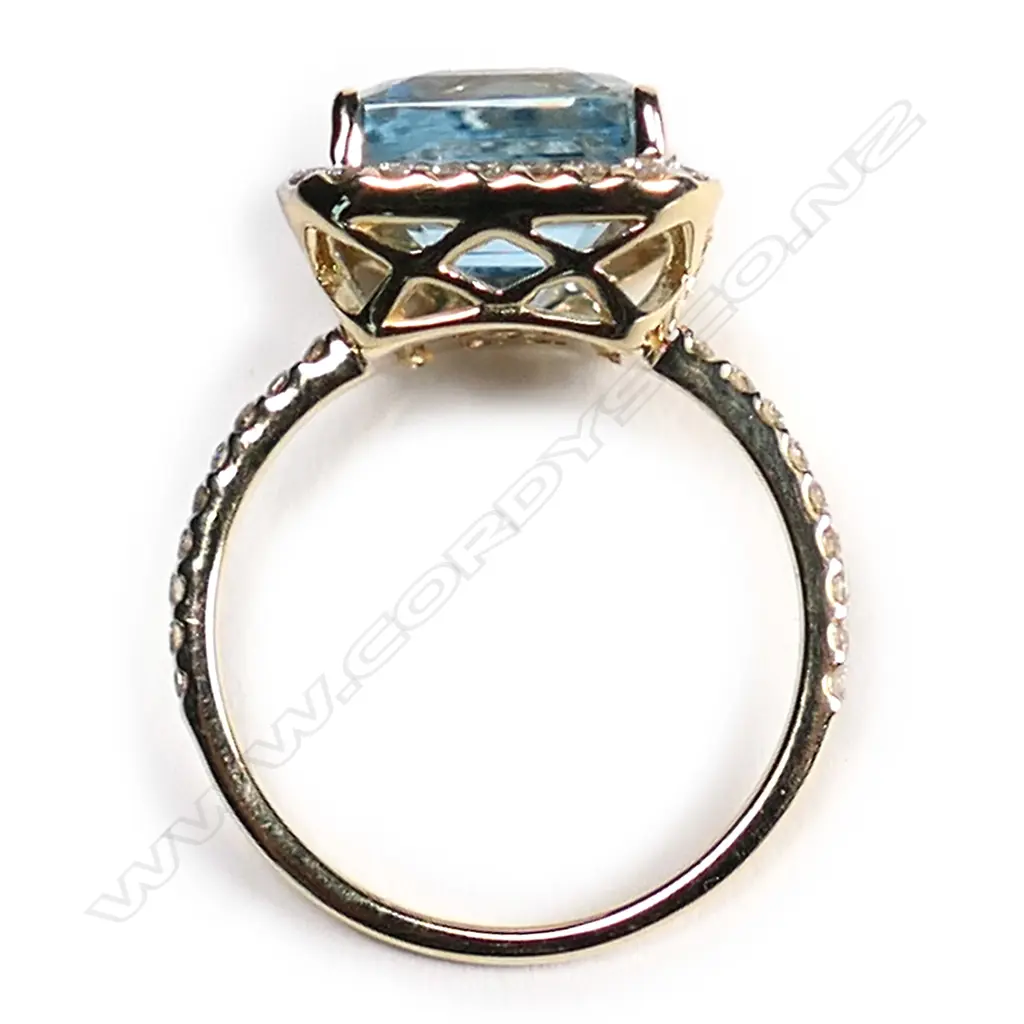 A 14ct. gold, aquamarine and diamond halo ring, Image 1++
