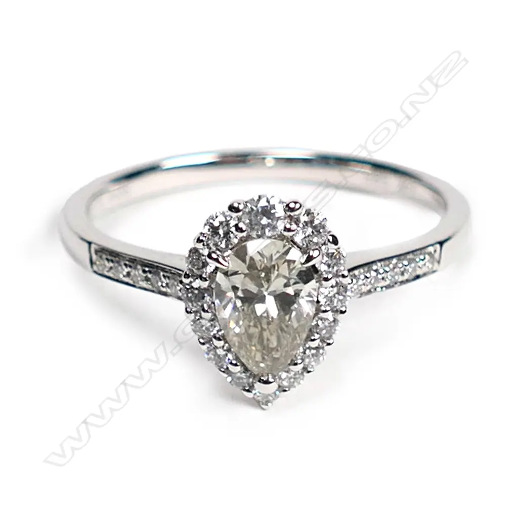 A 14ct white gold and diamond vintage style halo ring, Image 1++