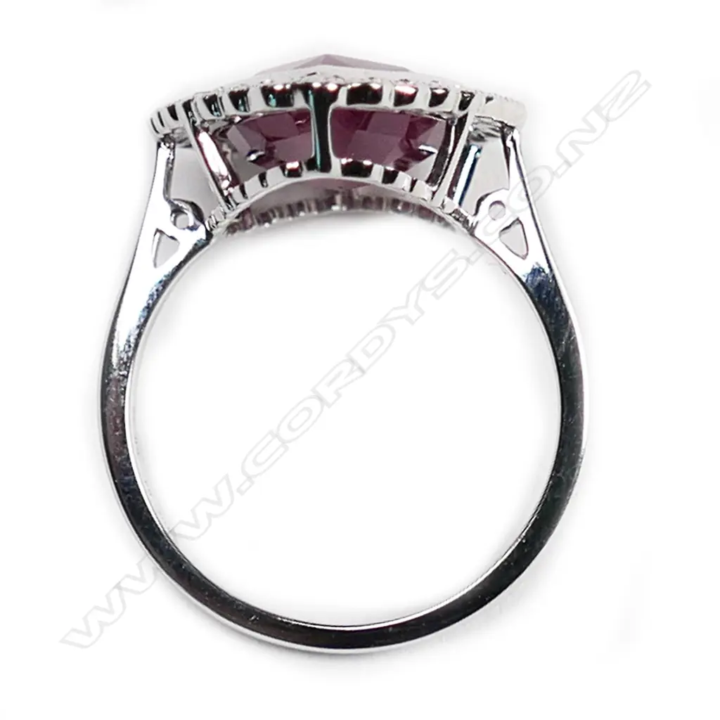 A 14ct white gold, ruby and diamond vintage style halo ring, Image 1++