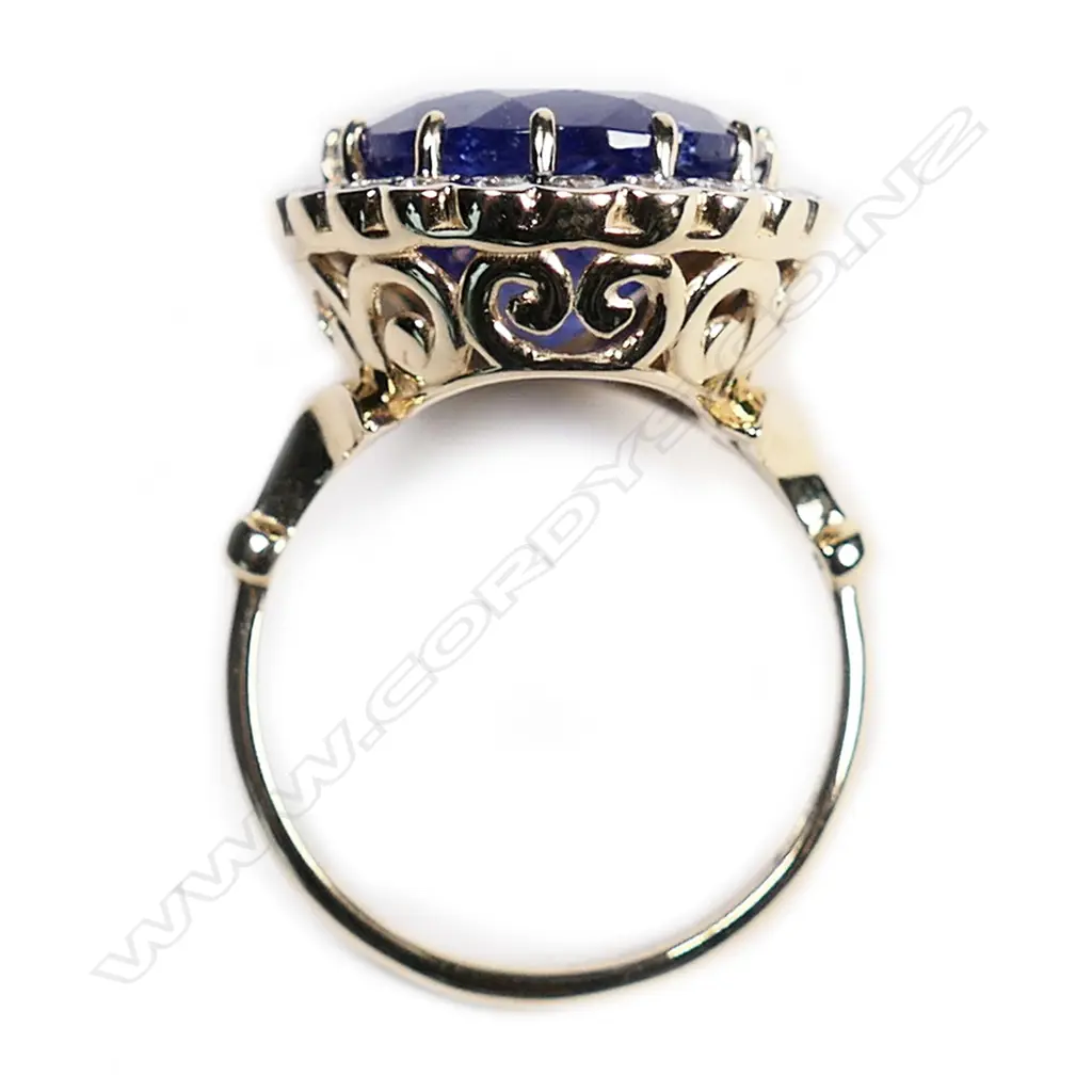 A 14ct gold, tanzanite and diamond vintage style halo ring, Image 1++