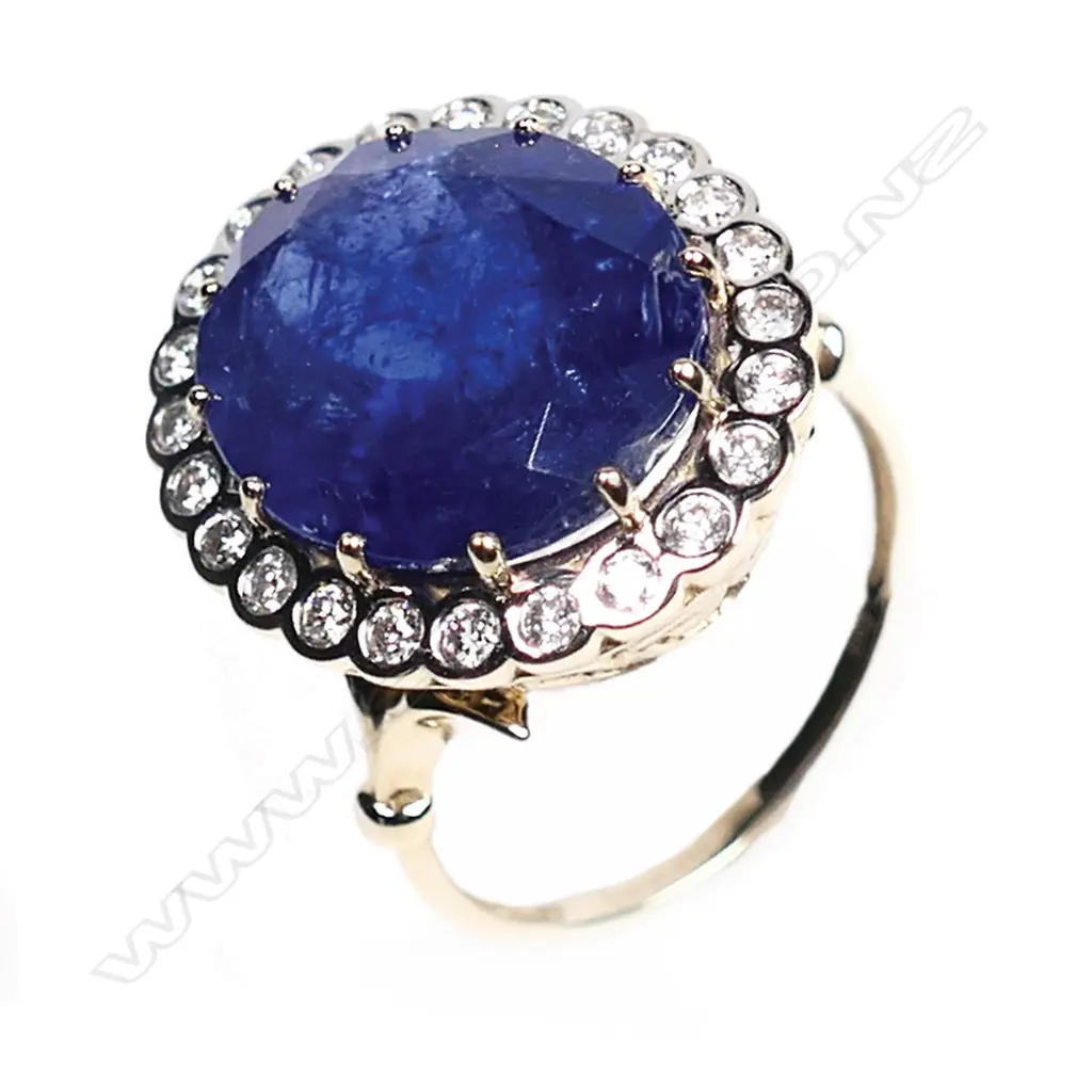 A 14ct gold, tanzanite and diamond vintage style halo ring, Image 1++