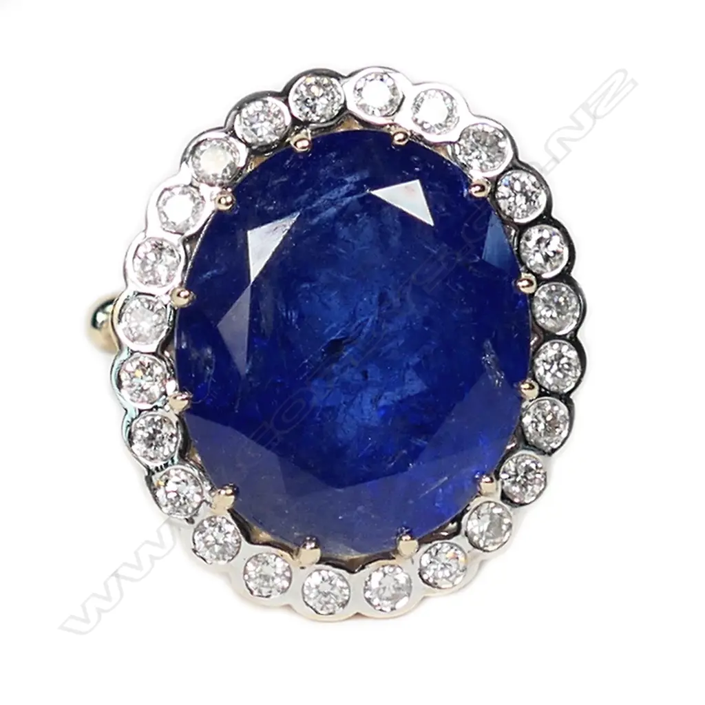A 14ct gold, tanzanite and diamond vintage style halo ring, Image 1++