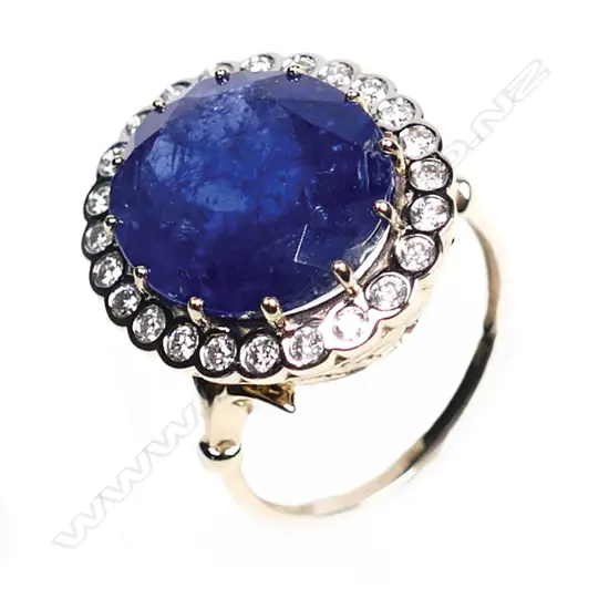 A 14ct gold, tanzanite and diamond vintage style halo ring,