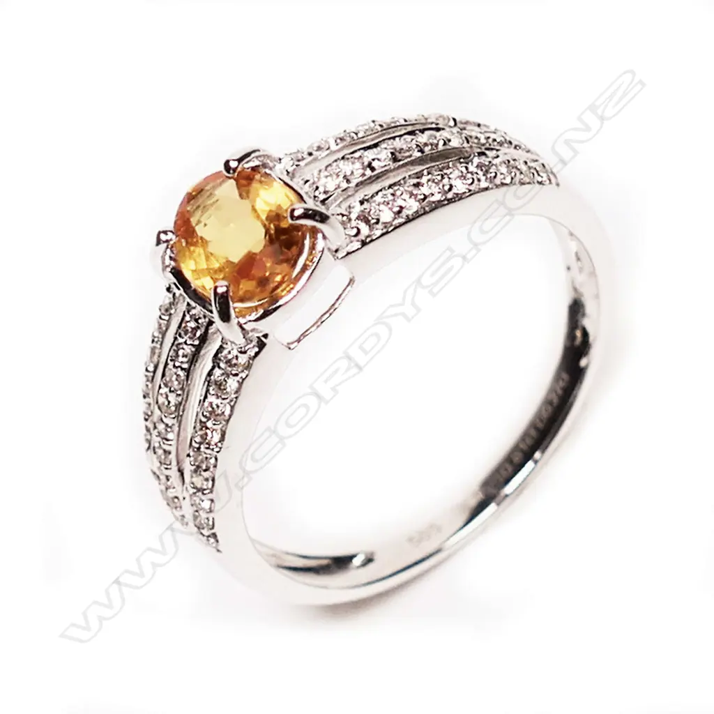 A 14ct white gold, yellow sapphire and diamond ring, Image 1++