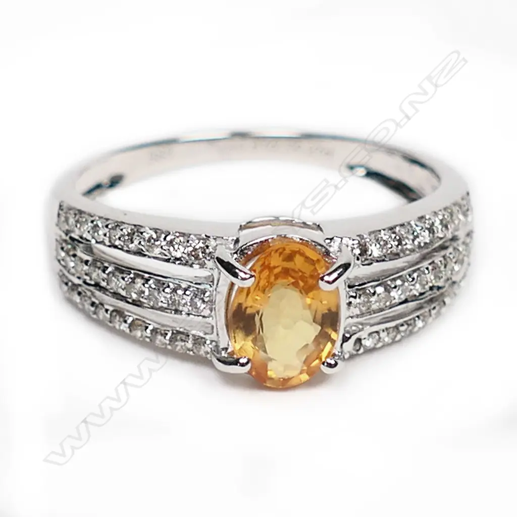 A 14ct white gold, yellow sapphire and diamond ring, Image 1++