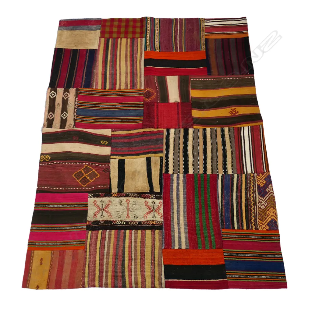 A Turkish patchwork carpet, made up of various coloured geometric patterned kilims. Image 1++