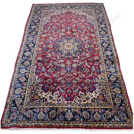 A fine large hand knotted Persian carpet,