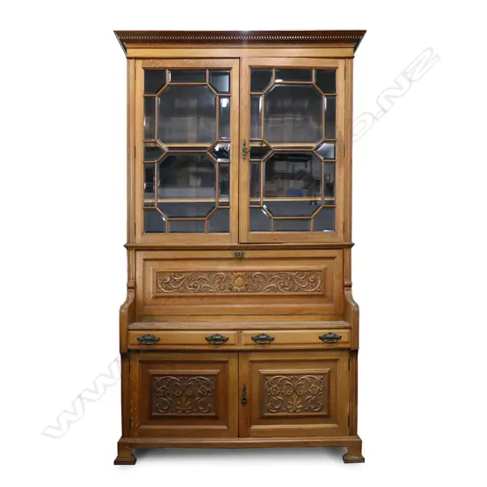An oak Arts and Crafts bureau bookcase,