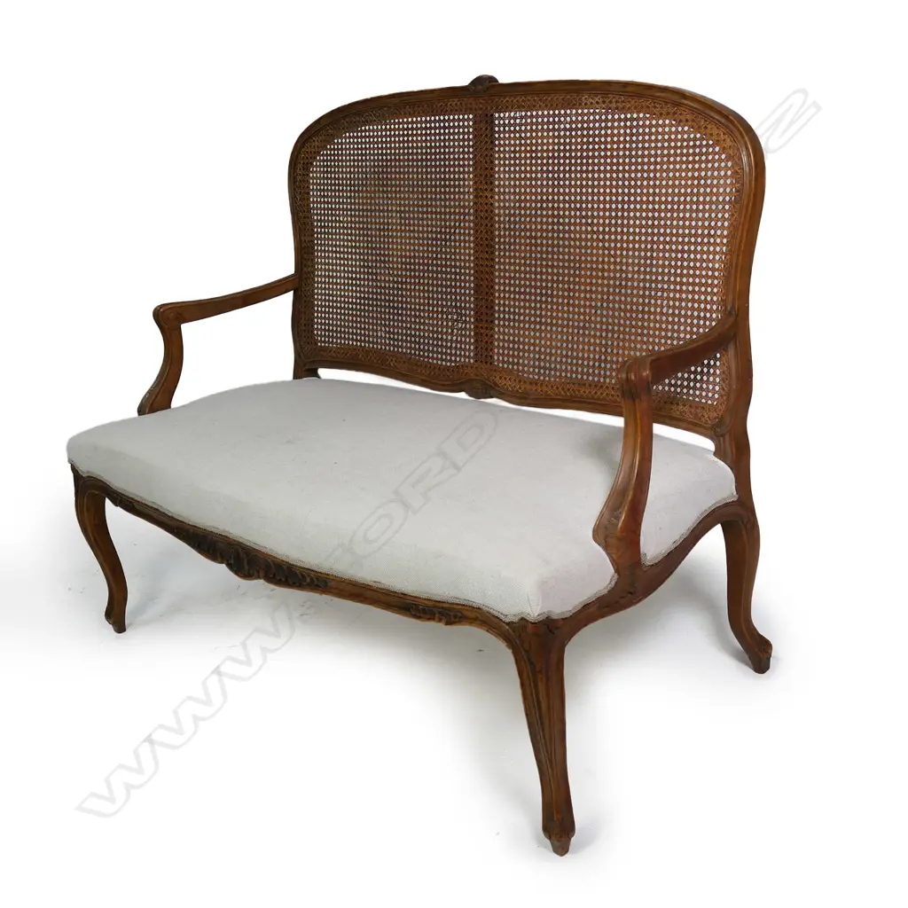 A French Louis XV style walnut framed, cane backed canapé, Image 1++