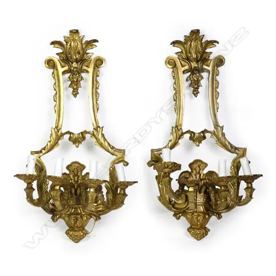 A pair of gilded brass wall sconces,