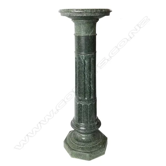 A late 19thC green marble torchiere column stand,