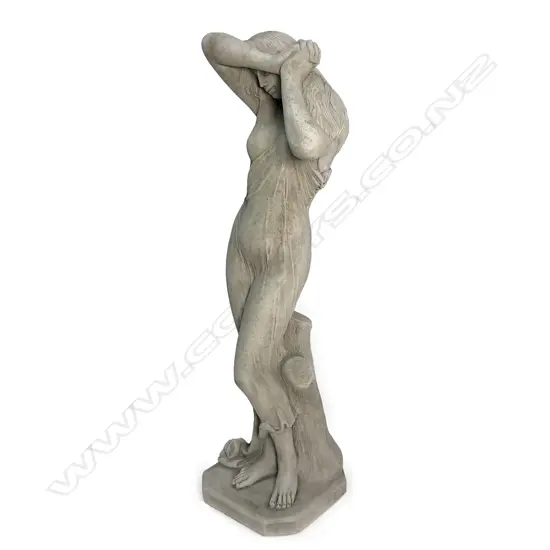 A tall classical garden statue of a semi naked maiden, 'Shy Girl',