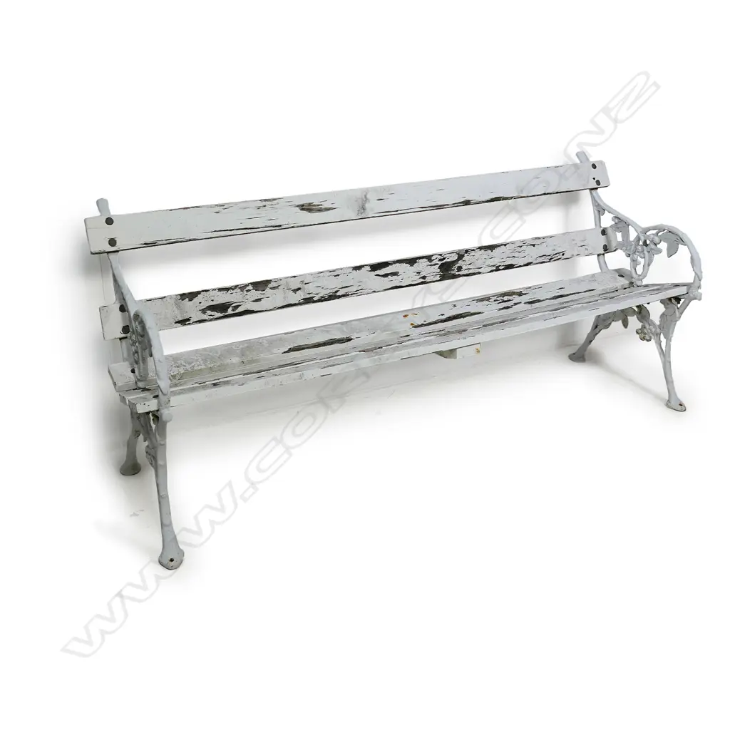 A cast iron and slatted wood garden bench Image 1++