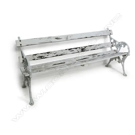 A cast iron and slatted wood garden bench