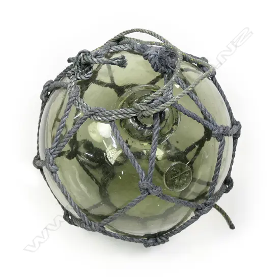 An old Japanese glass fishing float, hand blown,