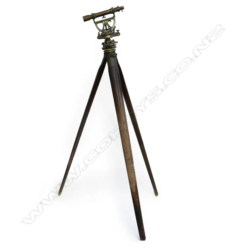 An early 20thC Troughton & Simms Ltd brass surveyor's theodolite, with folding wooden tripod stand, Image 1++