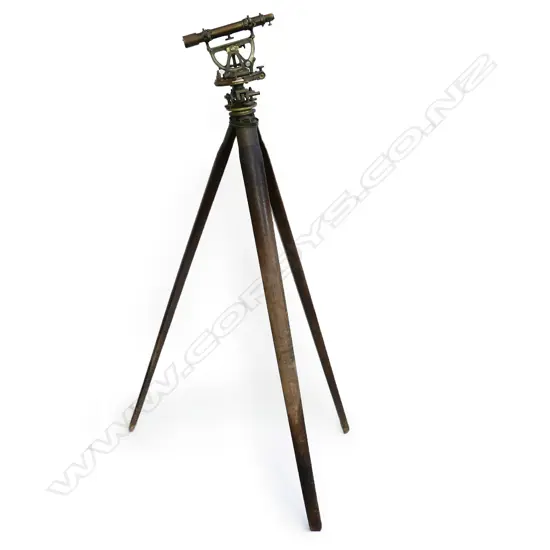 An early 20thC Troughton & Simms Ltd brass surveyor's theodolite, with folding wooden tripod stand,