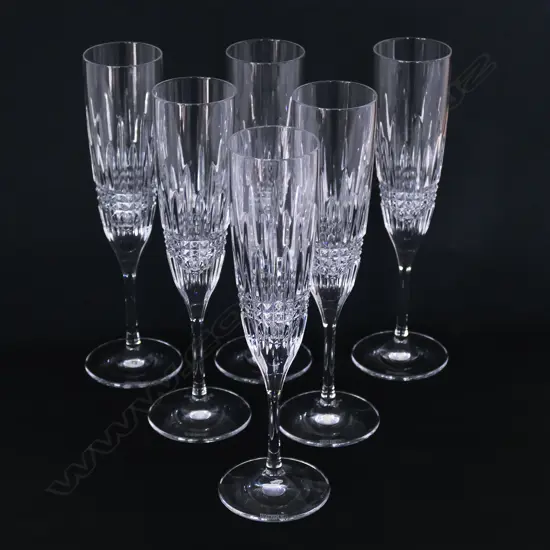 A set of six Waterford crystal champagne flutes,