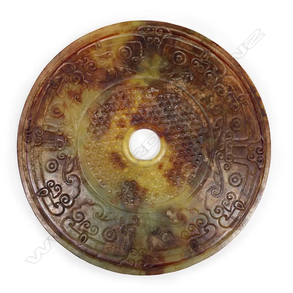 A large Chinese archaic style carved jade 'Lucky' coin Image 1++