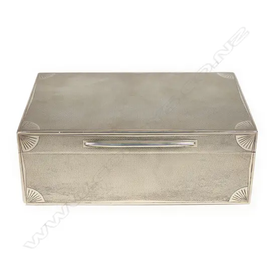 A silver cigarette box, of oblong shape, London 1929 by Ramsden & Roed,