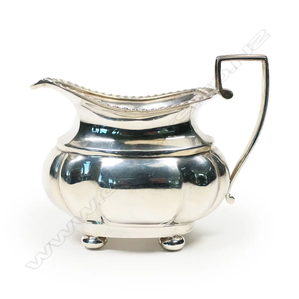 An Edwardian silver cream jug, Birmingham 1919 by S. Blanckensen & Sons Ltd. 102gm. Image 1++