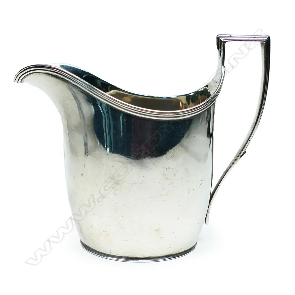 A George III silver flat bottom cream jug, London by John Emes. 164gm. Image 1++