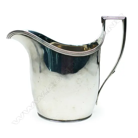 A George III silver flat bottom cream jug, London by John Emes. 164gm.