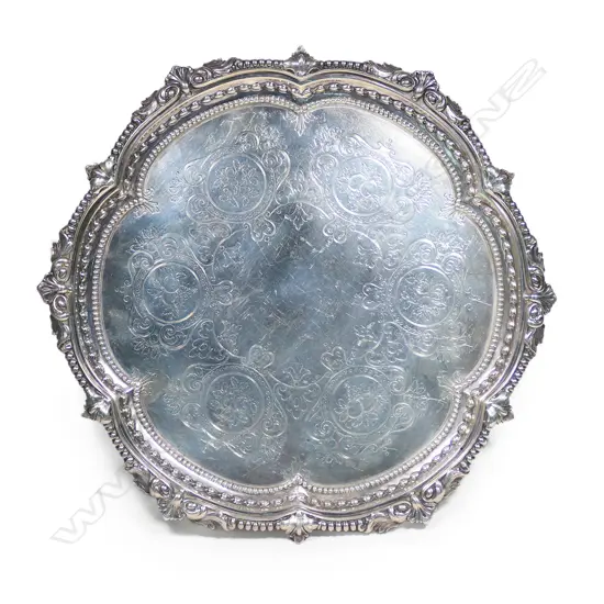 A Victorian silver salver, London 1874 by Martin, Hall & Co. 830gm.