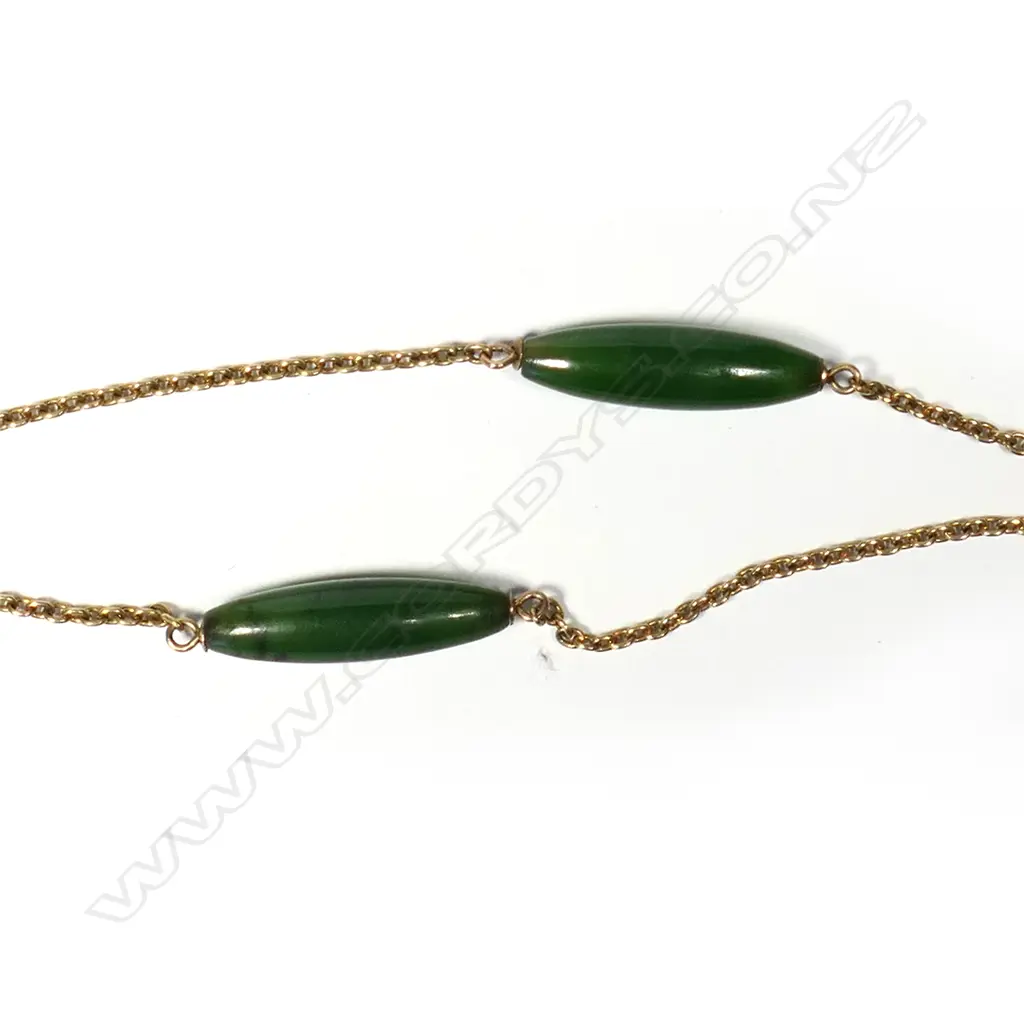 An impressive c.1900 9ct yellow gold and nephrite muff chain with nephrite and gold heart pendant, Image 1++