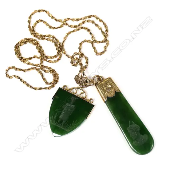A vintage 9ct yellow gold neck chain with two intaglio cut Māori themed pendants,