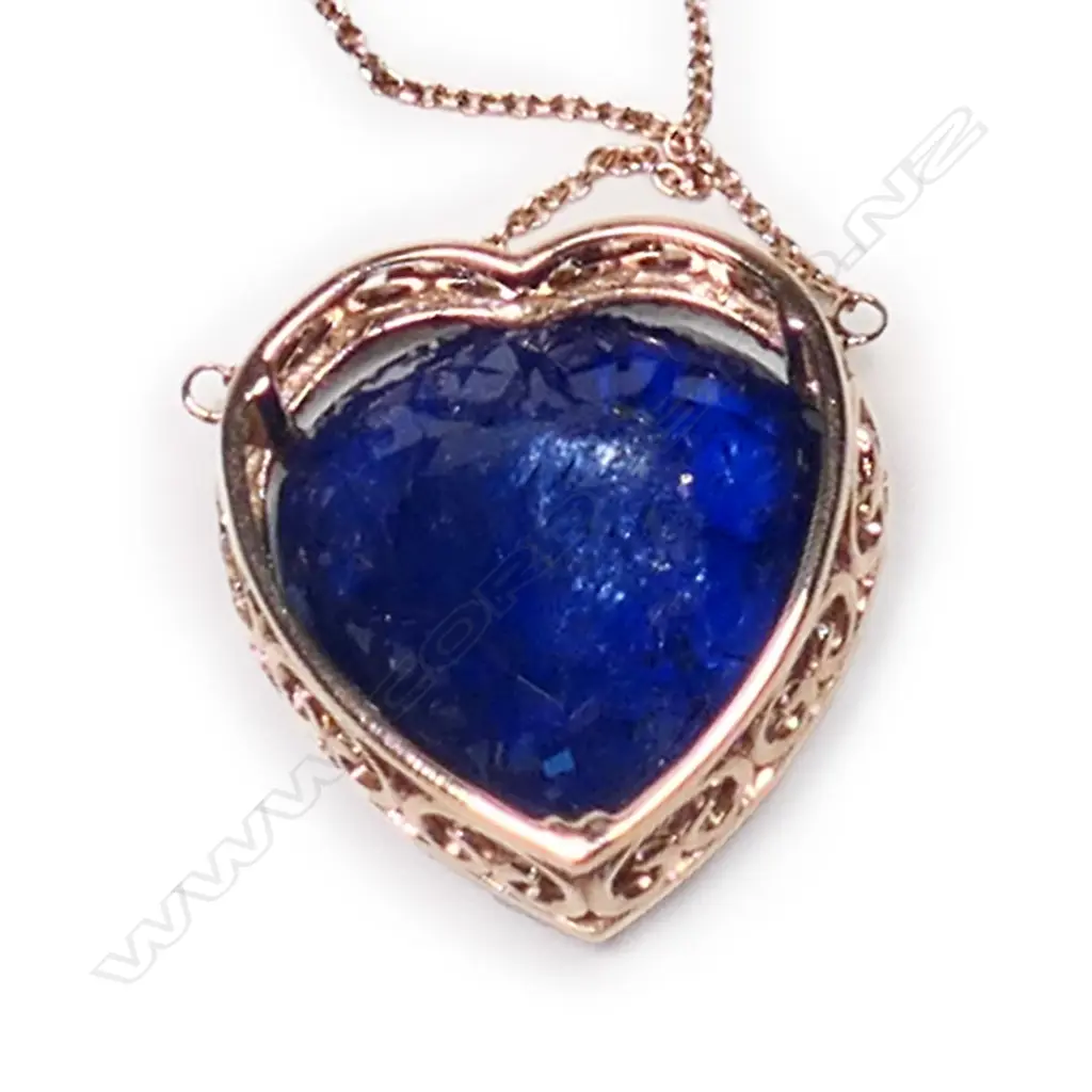 A 14ct rose gold, tanzanite and diamond halo heart shape pendant, Image 1++