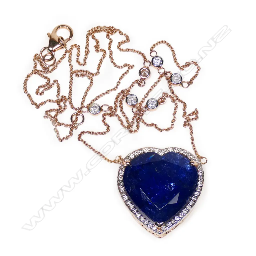 A 14ct rose gold, tanzanite and diamond halo heart shape pendant, Image 1++