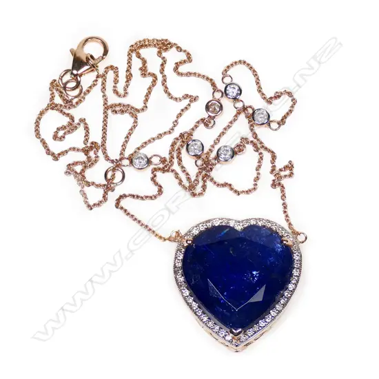 A 14ct rose gold, tanzanite and diamond halo heart shape pendant,