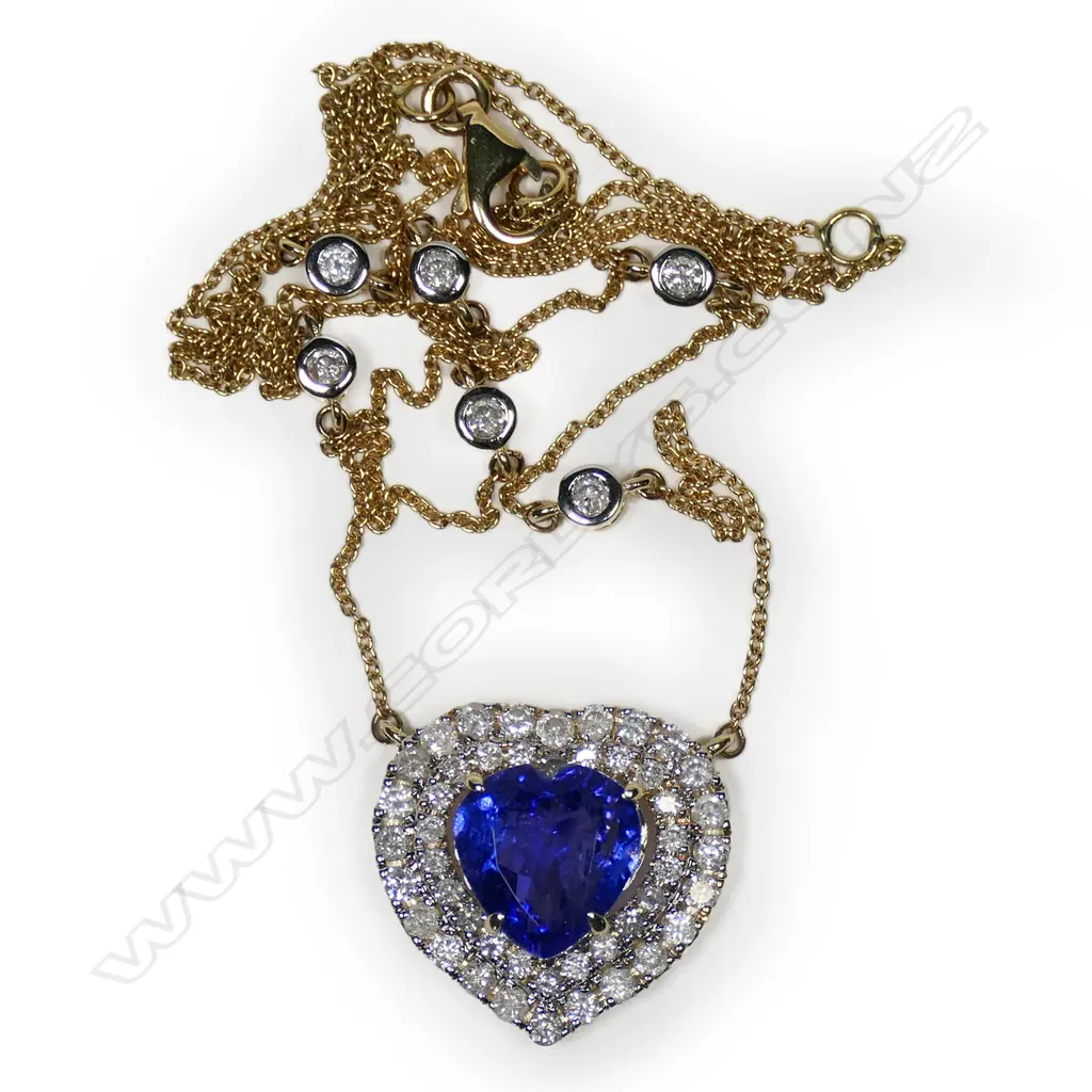 A 14ct gold, tanzanite and diamond double halo heart necklace, Image 1++