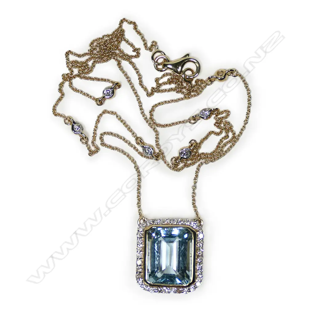 A 14ct gold, aquamarine and diamond halo necklace, Image 1++