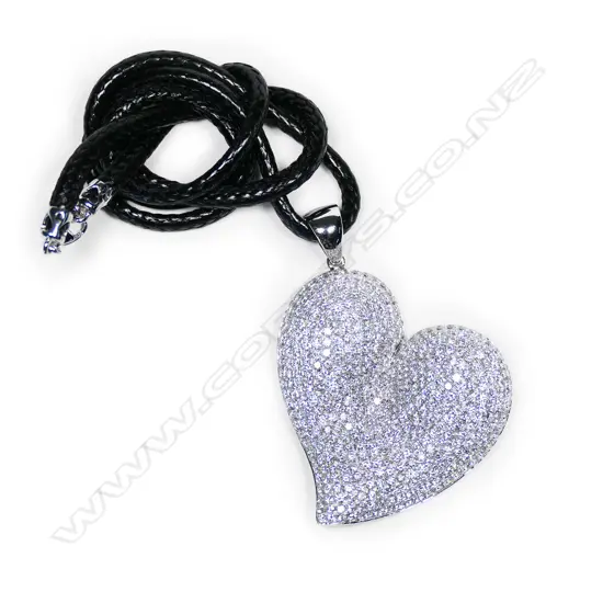 An impressive18ct white gold and diamond large heart pendant,