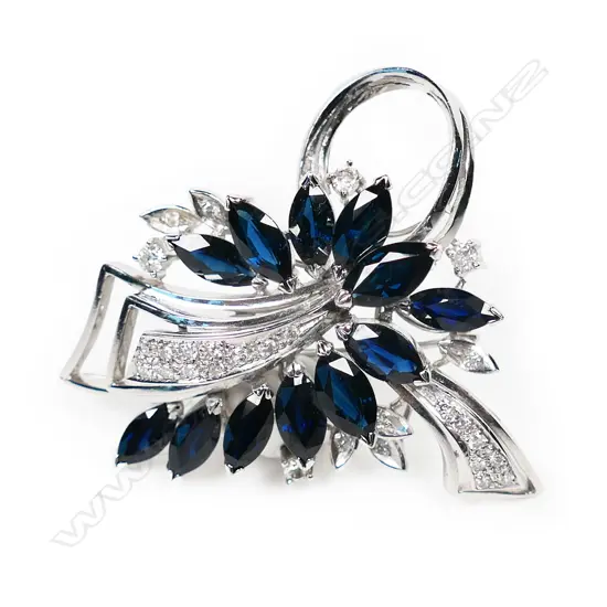 An 18ct white gold diamond and sapphire brooch,