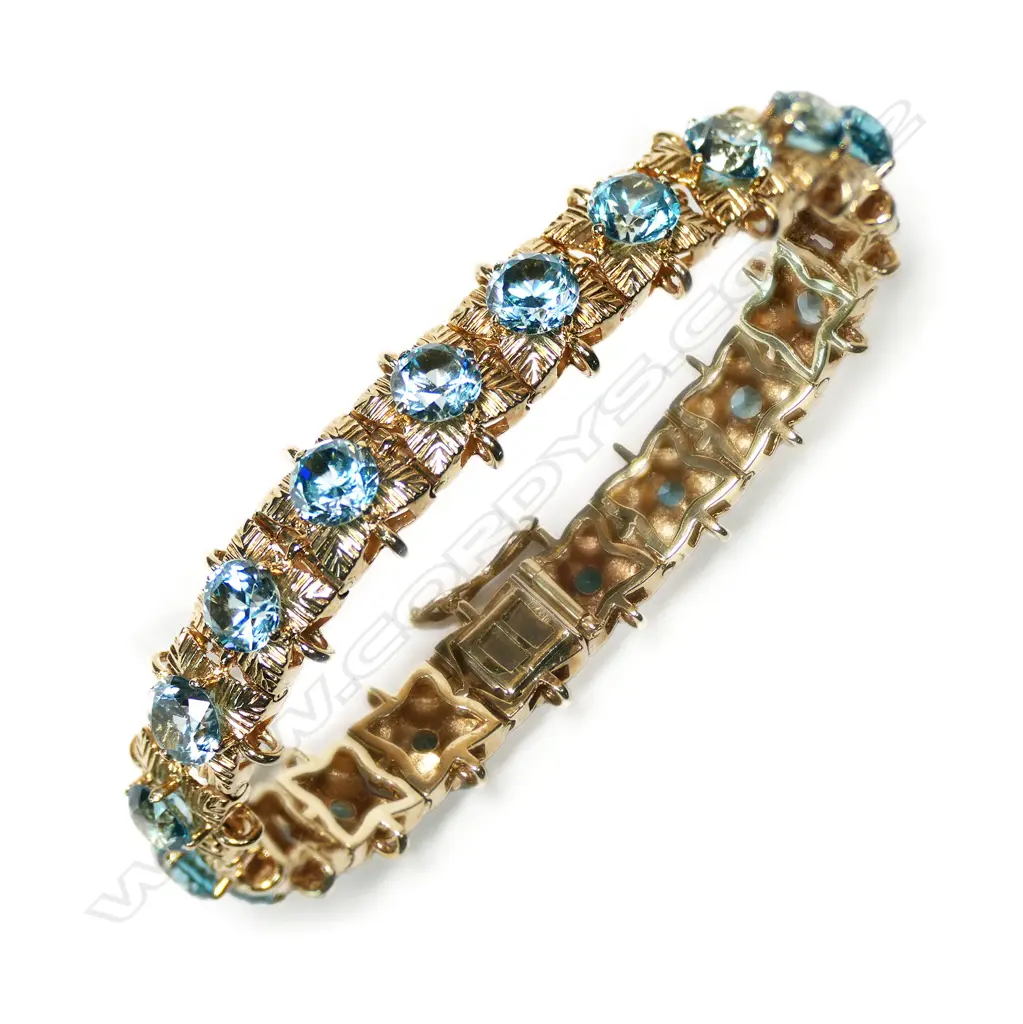 A 9ct gold and blue zircon bracelet, Image 1++