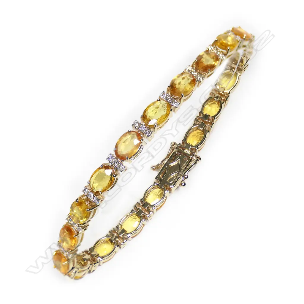 A 14ct gold, orange sapphire and diamond tennis bracelet, Image 1++