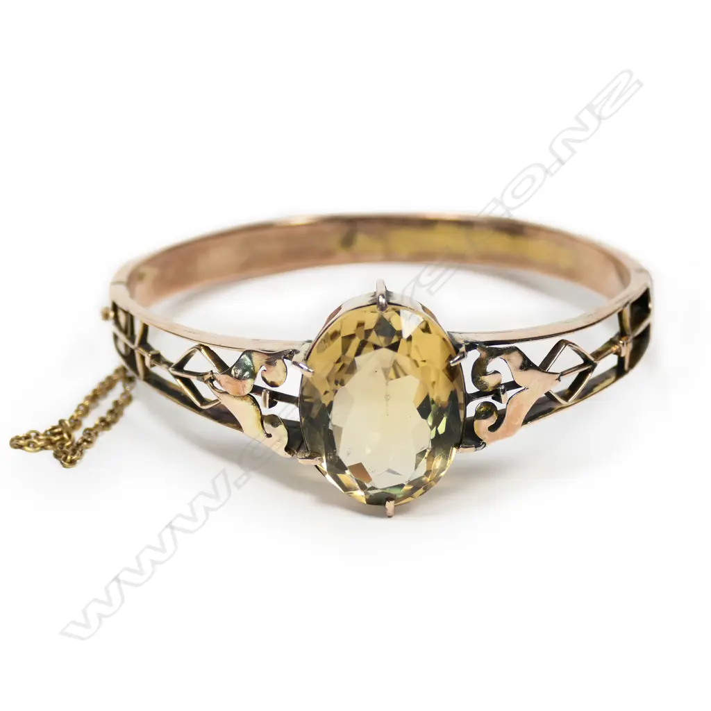 An early 20thC, 9ct rose gold and large citrine hinged bangle, Image 1++