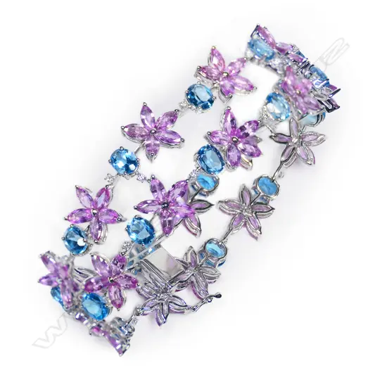 An 18ct white gold, diamond and coloured sapphire wide bracelet,