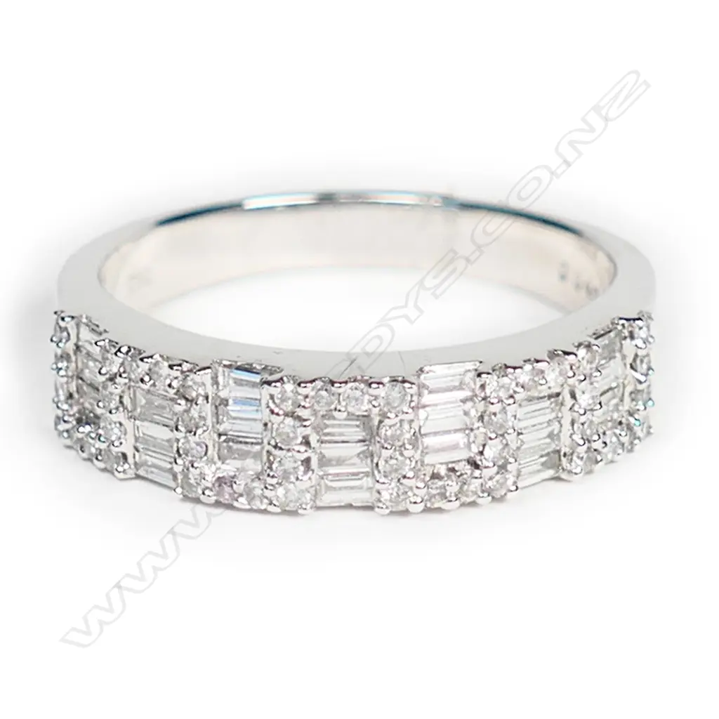 An 18ct white gold and multi diamond band ring, Image 1++