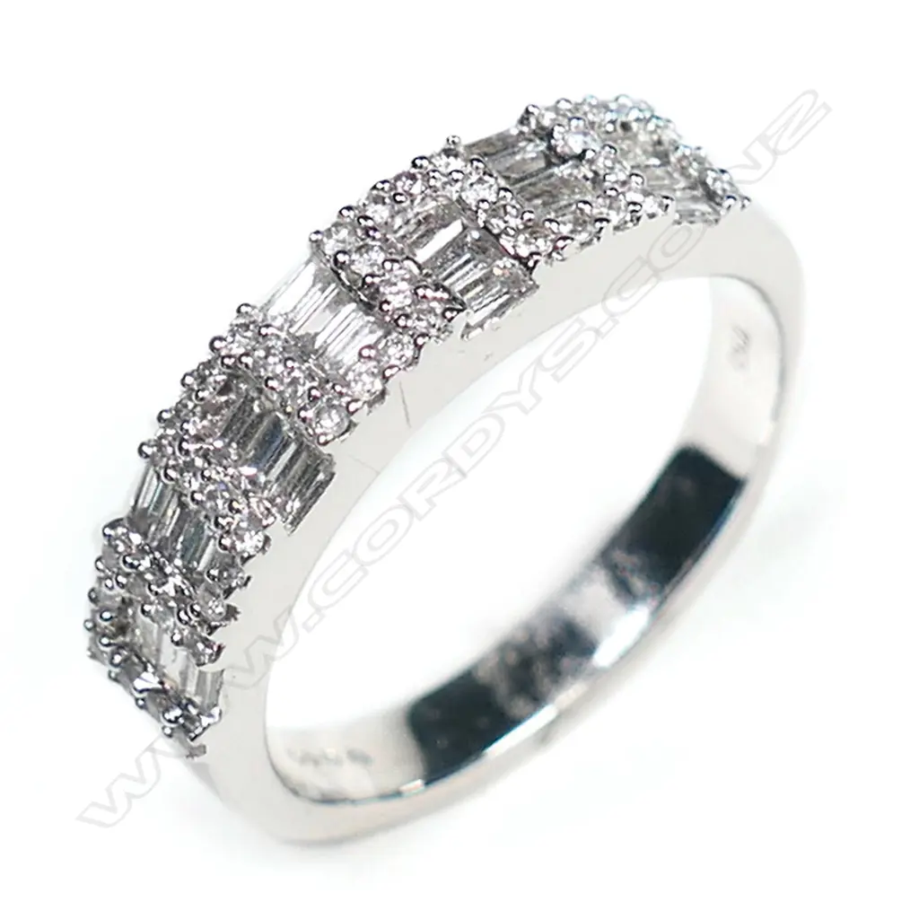 An 18ct white gold and multi diamond band ring, Image 1++